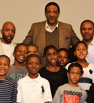 Clyde Mayes with group of children